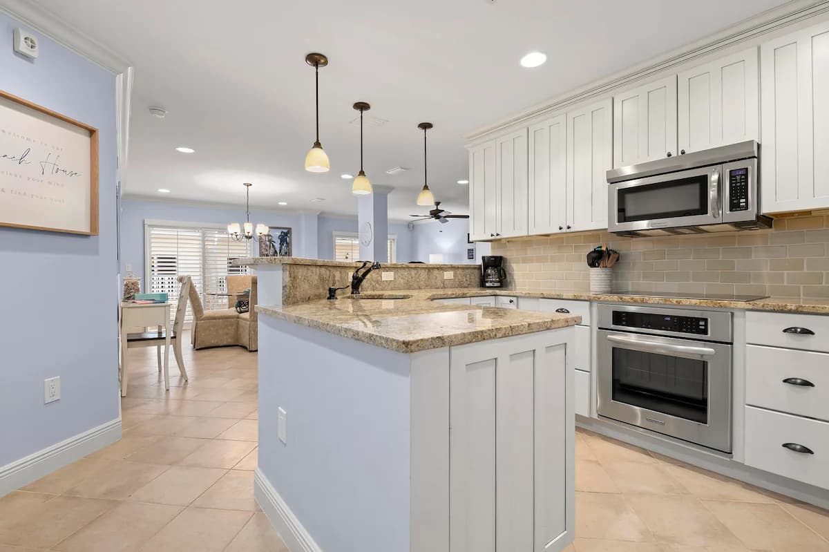 Heated Pools & Spa · Private Beach + Bay Views