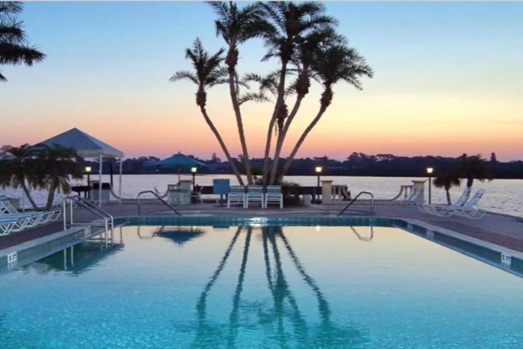 Private Beach · Heated Pools & Spa · Bay Views